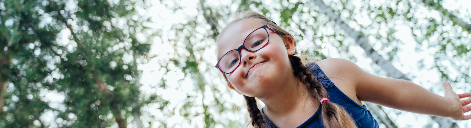 Children's Services - girl in pigtails smiling at camera